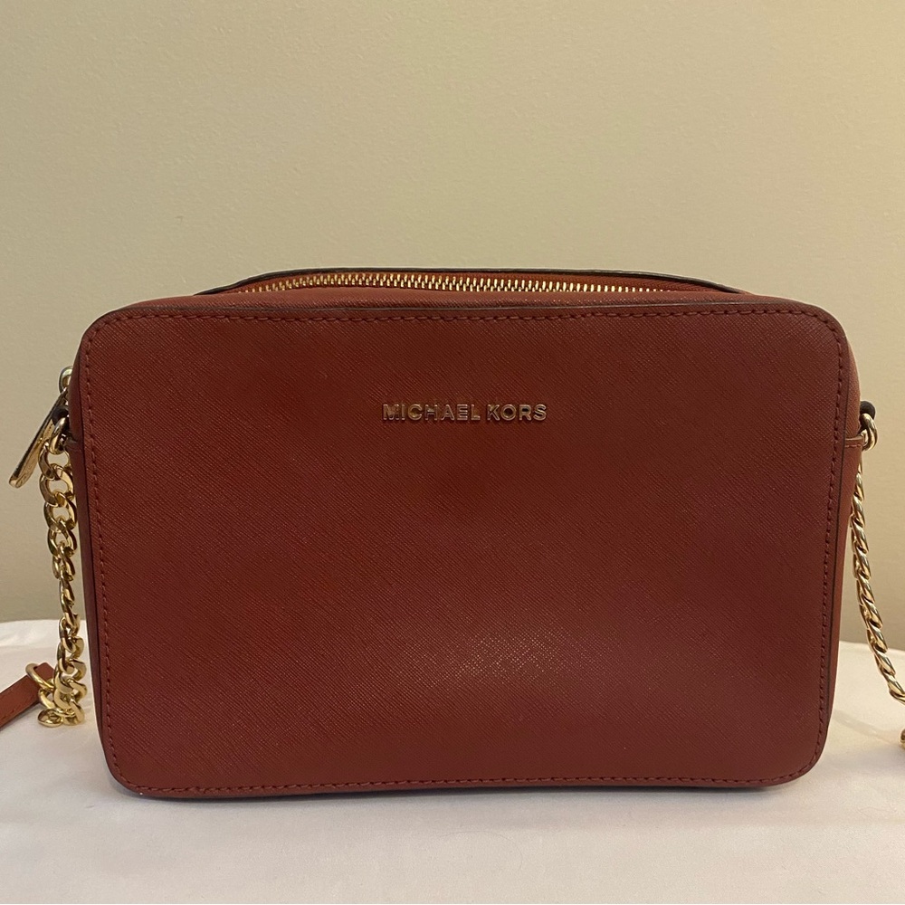 Michael kors wine colored shoulder bag in excellent condition barely used